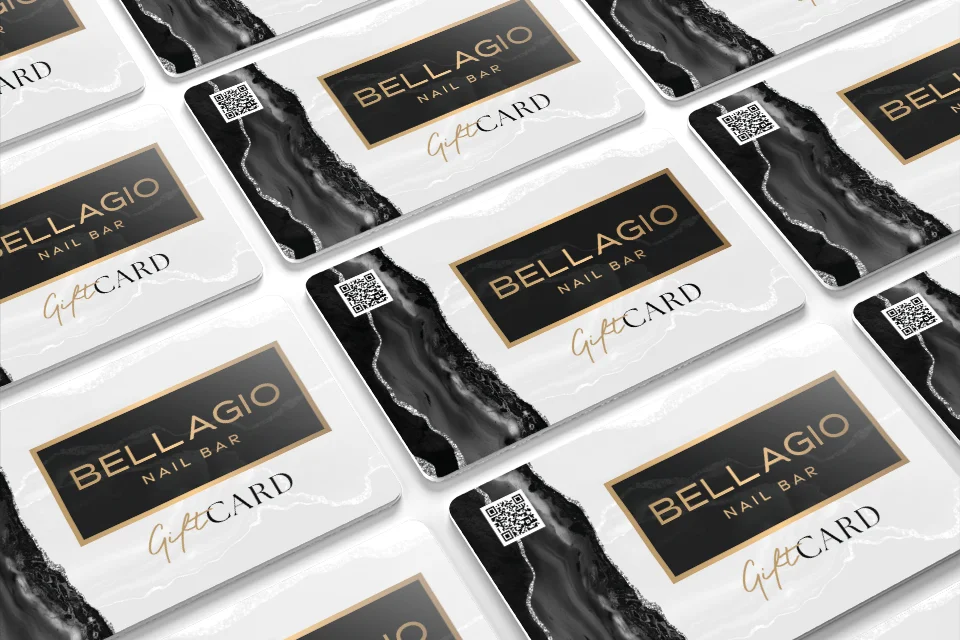 Black and gold Bellagio Nail Bar gift cards laid out in rows
